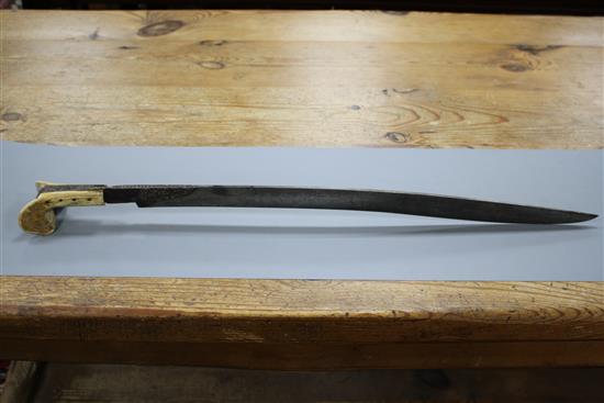 A Turkish sword Yataghan, with silver inlaid decoration and inscription, ivory grips, overall length 72cm